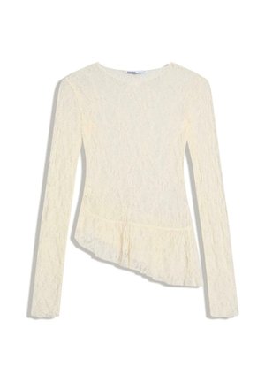 Krémový krajkový top s dlouhým rukávem, kulatým výstřihem a asymetrickým volánovým lemem, přiléhavý střih.