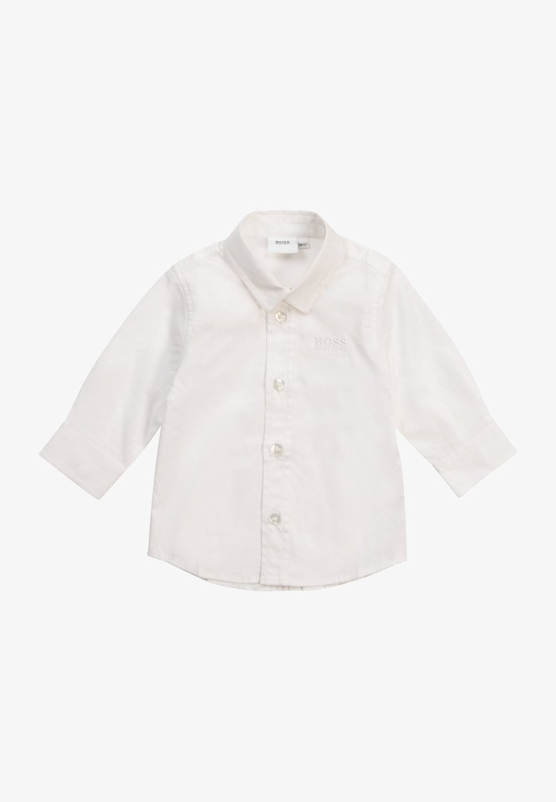 Vit långärmad skjorta i bomull med spetsig krage, med knappstängning och diskret broderad logotyp på bröstet.