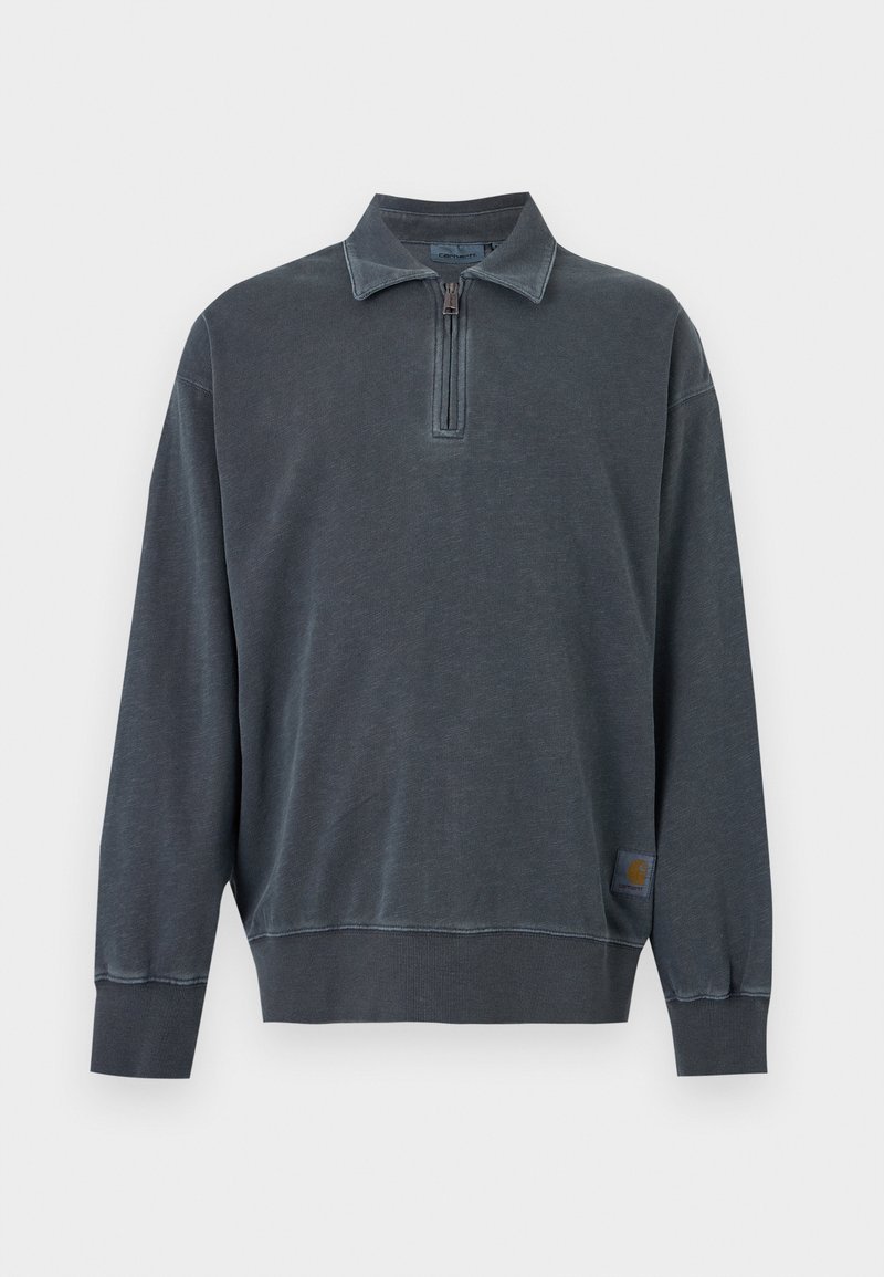 Dark gray long-sleeve pullover with half-zip collar and ribbed cuffs and hem, featuring a small logo patch near the bottom hem.