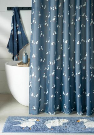 Blue bathroom set with puffin bird patterns on shower curtain, bath towel, soap dispenser, and matching floor mat by a white bathtub.