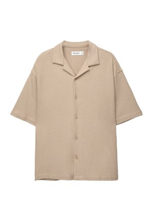 Beige kortom shirt met korte mouwen van structuurstof, voorzien van een kraag en vijf knopen aan de voorkant. Rechte zoom en brede mouwen.