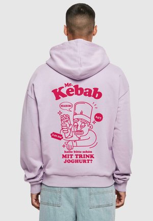 Lavender hoodie featuring a graphic print with a cartoon chef holding a kebab, bold pink text reading "Mr. Kebab," and playful accents.
