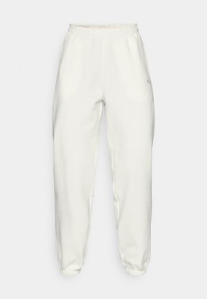 Lyse fargede joggebukser i bomullsblanding med elastisk midje og mansjetter. Har sidelommer og en liten logo på hoften.