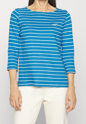 Niebiesko-biały, w paski, długi rękaw, bluzka z okrągłym dekoltem. Wykonana z bawełny, z małym haftowanym detalem "radosny" na klatce piersiowej.