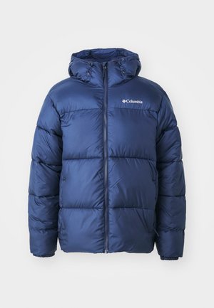 Navyblauer Pufferjacke mit Kapuze, featuring einen Reißverschluss vorne, elastische Bündchen und ein gestepptes Design. Columbia-Logo auf der oberen linken Brust.