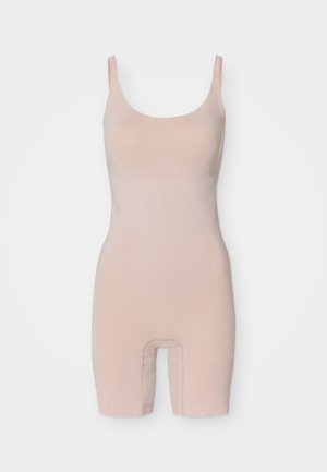 Gole bôdysuit v nude barvi z izrezom na vratu, nastavljivimi naramnicami in oprijetim krojem. Material je gladek z lahkotno teksturo.