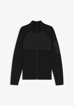 Czarna kurtka na zamek z wysokim kołnierzem, z kolorowymi blokami, teksturowanymi panelami na rękawach oraz kieszenią na zamek na ramieniu.