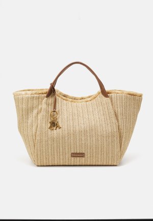 Beige woven straw tote bag with brown leather handles. Features a keychain accent and a structured shape, ideal for casual use.