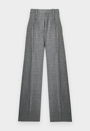Pantalon large taille haute à motif pied-de-poule noir et blanc, avec une ceinture élastique et des plis sur le devant.