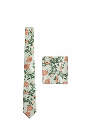 Silk tie and pocket square set with a green and orange floral pattern on a white background, shown flat on white surface.
