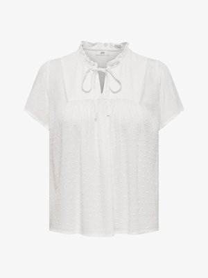 White blouse with short sleeves, ruffled neckline, keyhole front with tie detail, textured fabric featuring raised polka dots.