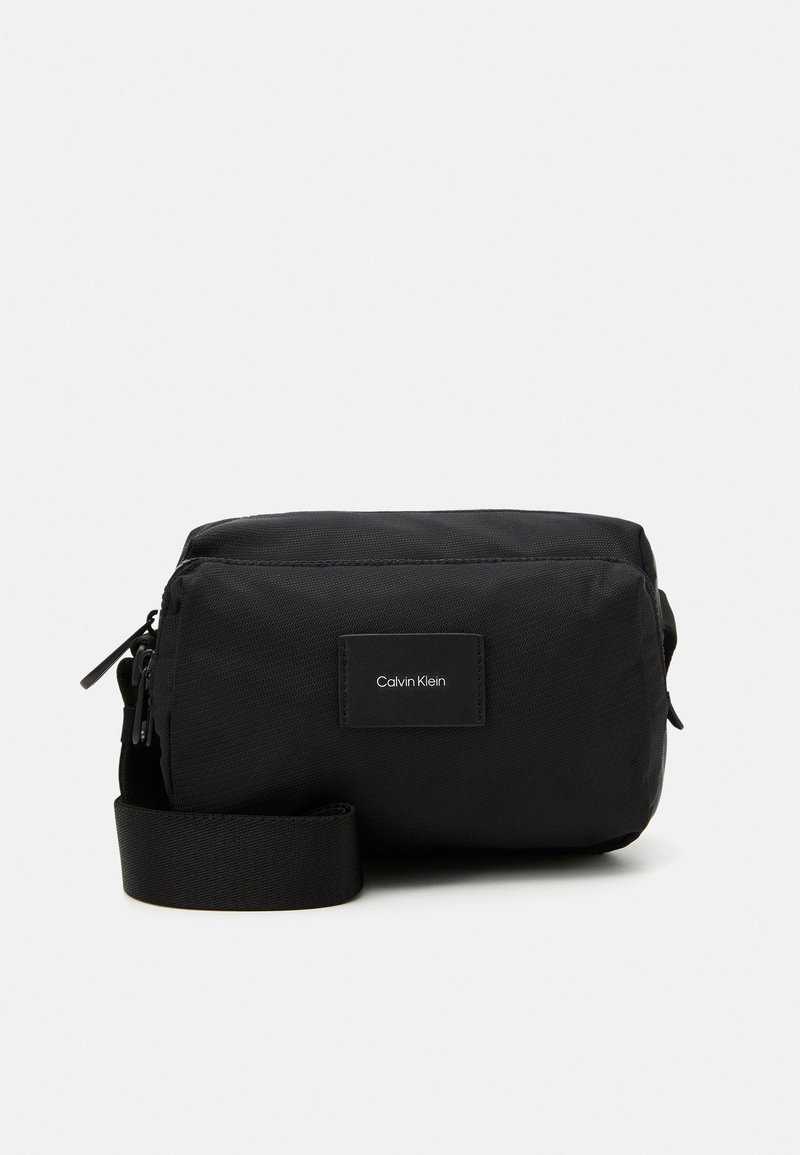 Calvin Klein MUST CAMERA BAG UNISEX Across body bag black Zalando
