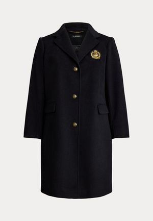 Laivaston sininen villasekoitetakki, jossa on laipat, kullanväriset napit, sivutaskut ja kirjailtu tunnus rinnassa.