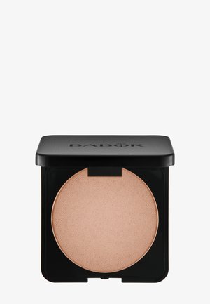Compact beige pressed powder in a black square case with slightly rounded edges, opened to reveal the product inside.
