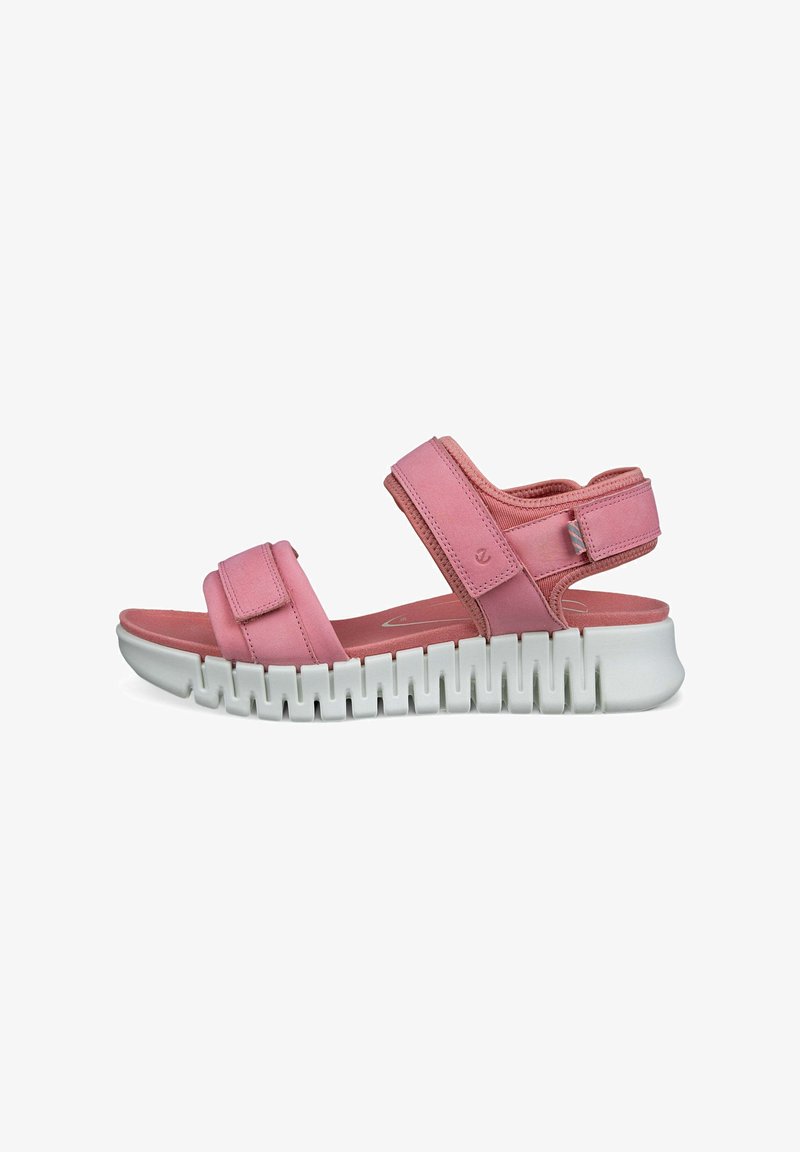 Pink sandals with adjustable straps, cushioned footbed, and a white, ridged rubber sole. Smooth texture with minimalist design.