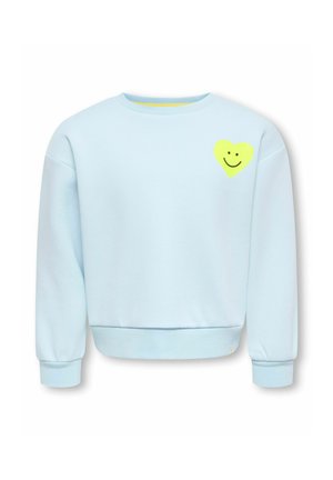 Sweat bleu clair à manches longues avec poignets et ourlet côtelés, avec un petit cœur jaune orné d’un visage souriant noir sur la poitrine gauche.
