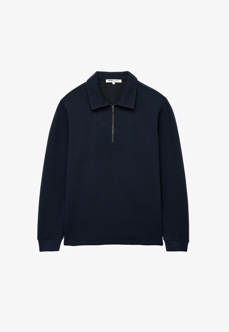 Granatowy sweter z teksturowanej dzianiny, z zapięciem na zamek przy kołnierzu i długimi rękawami. Prosty, minimalistyczny design bez wzorów.