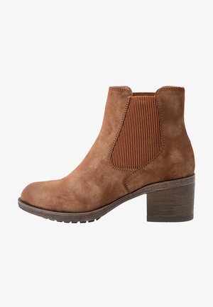 Brown suede ankle boot with ribbed elastic side panels, rounded toe, and a stacked wooden heel, featuring a textured surface.