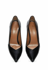 Black leather high-heeled pumps with a pointed toe, featuring a smooth texture and subtle cut-out design on the sides. Brown insoles.