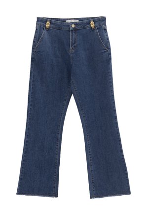 Denim flared jeans in dark blue with a mid-rise waist, featuring gold hardware at the waistband and raw hem edges.