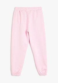 Roze sweatpants met een elastische tailleband, taps toelopende benen en gathered cuffs. Gemaakt van zachte, rekbare stof met een gladde textuur.