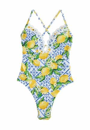 One-piece swimsuit featuring a lemon print on a blue background, scalloped trim, and crisscross straps. Made of stretchable fabric.