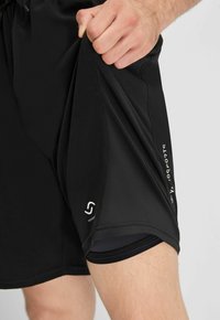 Formbelt 2-IN-1 - Jogginghose - schwarz