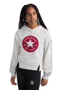 Hoodie cinza claro com um logo circular rosa que diz "CONVERSE ALL STAR", apresentando um design de estrela. Mangas longas e fendas laterais na bainha.