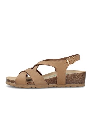 Sandalo zeppa donna in pelle color cuoio con suola in sughero, cinturino regolabile alla caviglia e cinturini frontali intrecciati su sfondo bianco.