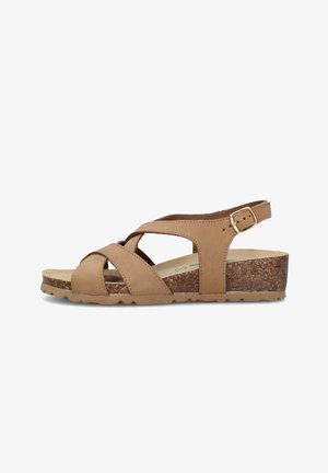Sandalo zeppa donna in pelle color cuoio con suola in sughero, cinturino regolabile alla caviglia e cinturini frontali intrecciati su sfondo bianco.