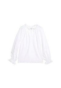 Blouse blanche à manches longues avec un col à volants, présentant une découpe en V, des manches froncées et un ourlet festonné. Le tissu a des détails en œillets.