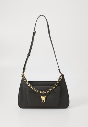 Black leather handbag with a structured shape, gold chain accent, and a front pocket. Features an adjustable strap for versatile carrying.