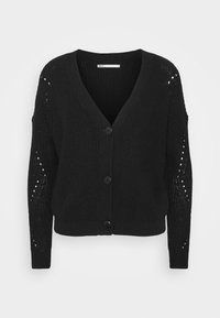 Czarny dziany kardigan z dekoltem w serek, z zapięciem na guziki i ażurowymi wstawkami na rękawach. Charakteryzuje się luźnym krojem i prążkowanym dołem.