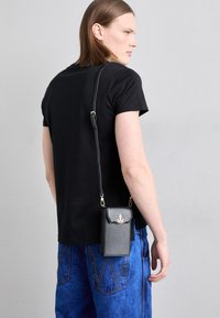 PHONE BAG UNISEX - Ovitek za telefon - black