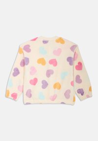 Fleece sweatshirt heeft een crèmekleurige achtergrond met meerkleurige harten in roze, paars, blauw en oranje. Geribbelde halslijn en manchetten.