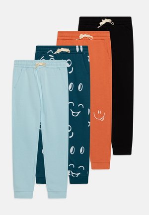 Vier Paar Jogginghosen: hellblau, türkis mit Smiley-Muster, orange mit Smiley-Grafik und einfarbig schwarz. Mit elastischen Taillenbündchen und Taschen.