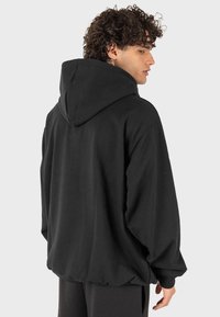 Kaotiko SUD CAP URBAN EYE - Felpa - black