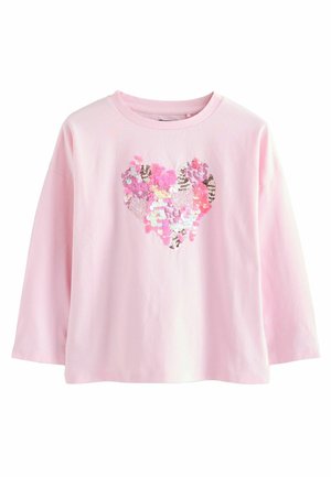 Camicia a maniche lunghe di un delicato rosa chiaro con un design a forma di cuore realizzato con paillettes colorate in diverse sfumature di rosa, viola e argento.
