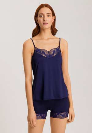 Navy blue camisole and shorts set. Camisole features lace trim along the neckline; shorts have lace accents on the hem. Smooth fabric texture.