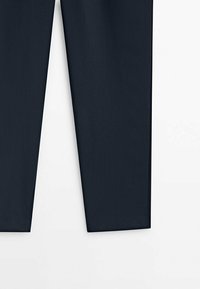 Slim-fit navy trousers made from a smooth, woven fabric, featuring clean lines and a flat front design for a tailored appearance.
