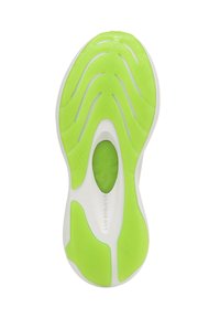 Semelle d'une chaussure avec un fond en caoutchouc vert vif aux rainures ondulées, une semelle intermédiaire blanche avec des découpes, et une finition lisse.