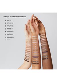 Long-Wear Cream Shadow Stick swatches on three arms showing various shades: light to dark browns, creams, and purples with numbered labels.