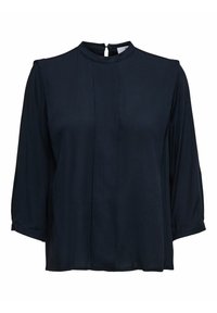 Blusa di un blu navy scuro con collo alto, maniche a tre quarti e chiusura a otre sul retro. Tessuto liscio con spalle leggermente arricciate.