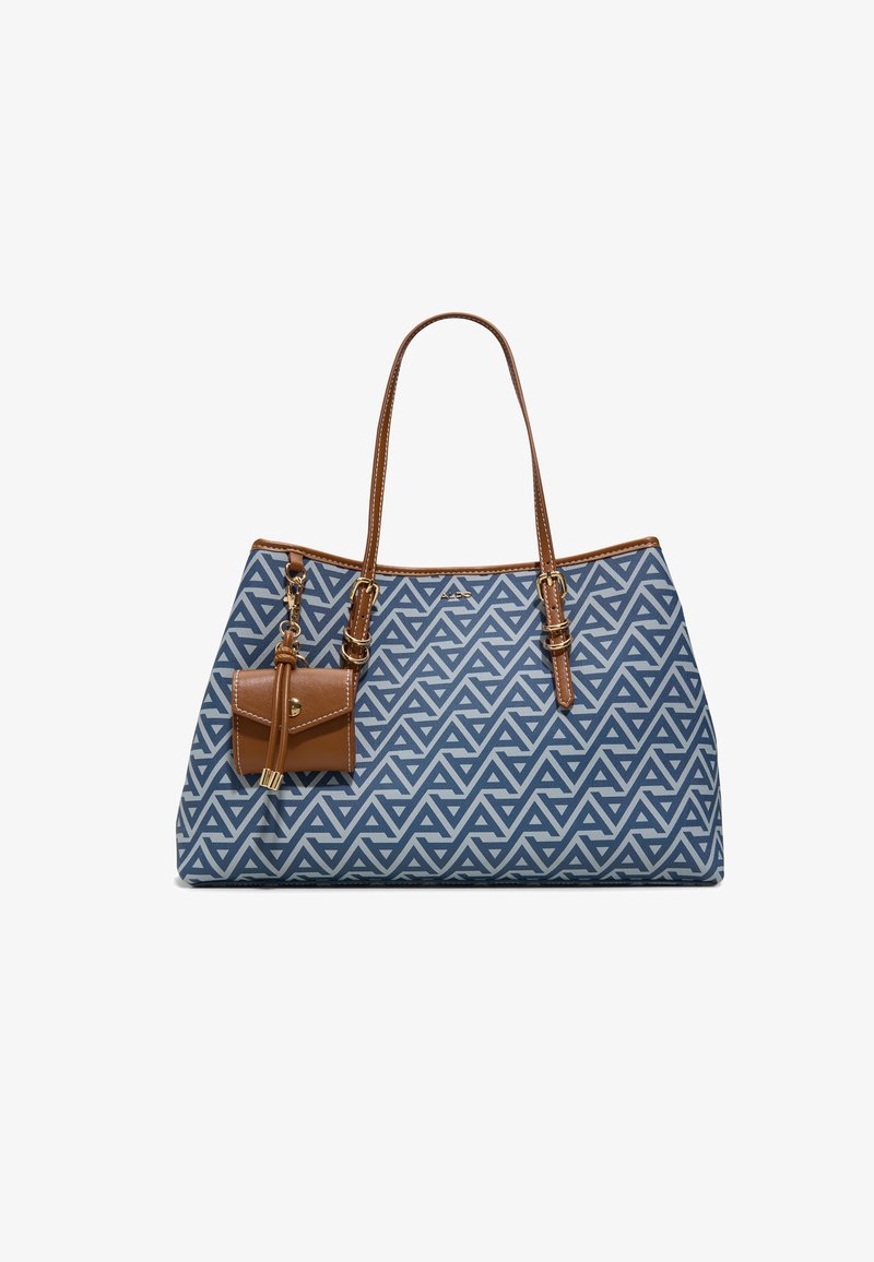 Bolso tote con patrón geométrico azul y blanco, asas de cuero marrón y pequeño bolso adicional de cuero marrón adjunto.