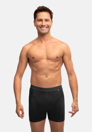 Boxer in cotone neri con elastico grigio in vita che riporta la scritta "Danish" e "End." Tessuto morbido, design aderente e lunghezza a metà coscia.