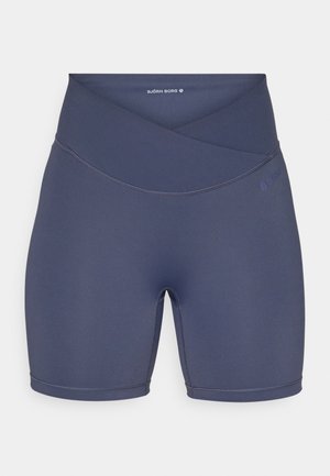 Navy blue high-waisted shorts made of stretchy fabric, featuring a crossover waistband design and flat seams for comfort.