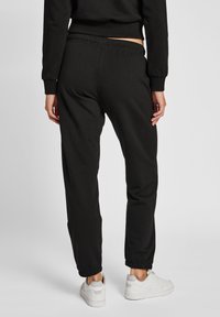 Hummel HMLLGC SHAI REGULAR  - Träningsbyxor - black