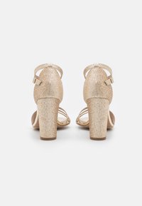 Tamaris Riemensandalette - light gold glam