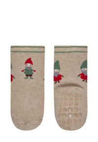 Beige Socken mit gestrickten Wichtelmotiven in Rot und Grün, mit einer strukturierten Griffsohle für zusätzlichen Halt. Grüner gestreifter Bündchendetail.