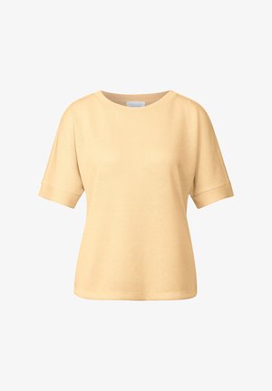 Haut jaune clair à manches courtes avec un col rond, coupe décontractée et tissu texturé. Présente des poignets roulés et un ourlet droit.